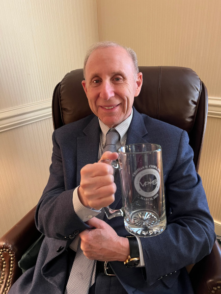 Dr. Blackman virtually presented a mug to Cristian D. Ciora, MD for his March 18, 2022 presentation to the Society