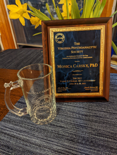 Monica Carsky, Ph.D. was presented with a plaque and engraved mug for her April 29 and 30, 2022 presentation of the Annual Vamik Volkan, M.D. Lecture